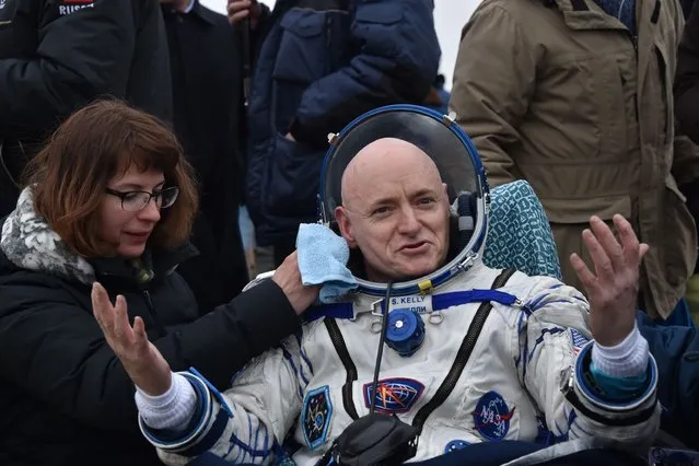 International Space Station (ISS) crew member Scott Kelly of the U.S. reacts after landing near the town of Dzhezkazgan, Kazakhstan, on March 2, 2016. US astronaut Scott Kelly and Russian cosmonaut Mikhail Kornienko returned to Earth on March 2 after spending almost a year in space in a ground-breaking experiment foreshadowing a potential manned mission to Mars. (Photo by Kirill Kudryavtsev/AFP Photo)