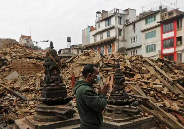 A man prays next to rubble of a temple, destroyed in Saturday's earthquake, in Kathmandu, Nepal April 28, 2015. (Photo by Adnan Abidi/Reuters)