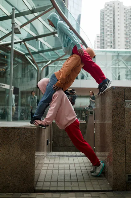 Dancers perform as human sculptures during an exhibition in Hong Kong, China, 26 March 2019. (Photo by Jerome Favre/EPA/EFE)