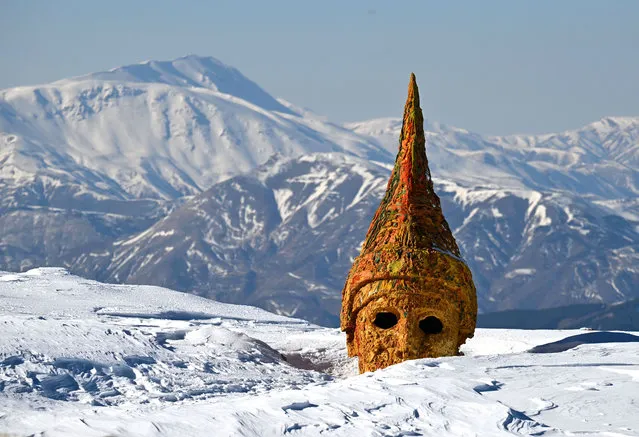 A view of snow blanketed ancient giant statues and remains, dating back to 2.000-year-old Commagene Kingdom, located in the 2.150-meter-altitude Mount Nemrut, which is listed in the UNESCO's World Heritage List, in Kahta district of Adiyaman, Turkiye on February 02, 2024. (Photo by Ozkan Bilgin/Anadolu via Getty Images)