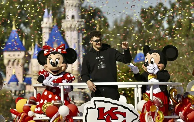 Super Bowl 58 MVP, Kansas City Chiefs quarterback Patrick Mahomes, center, greets fans on Main Street, U.S.A, during a cavalcade through Disneyland in Anaheim, Calif., Monday, February 12, 2024. The Chiefs beat the San Francisco 49ers, 25-22, on Sunday, Feb. 11, in Las Vegas. (Photo by Jeff Gritchen/The Orange County Register via AP Photo)