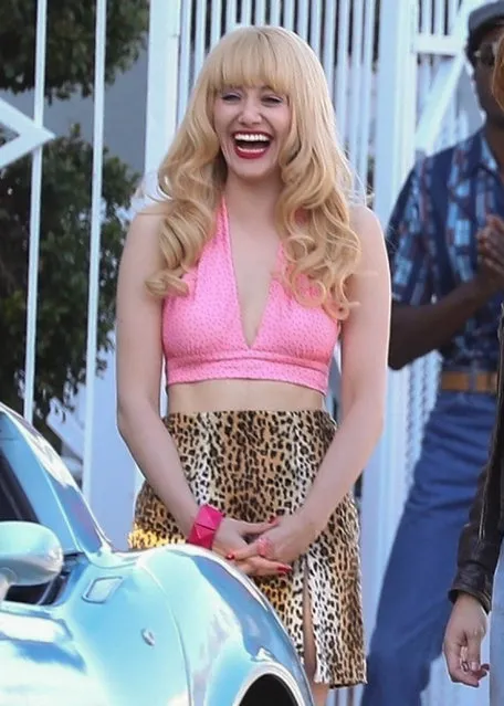 Actress Emmy Rossum has a laugh while filming a scene for “Angelyne” in Los Angeles on October 26, 2021. In the scene, Angelyne receives a marriage proposal from her love interest after giving her a new baby blue Corvette. (Photo by Backgrid USA)