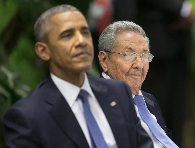 U.S. President Barack Obama, left, attends a State Dinner hosted by Cuban President Raul Castro, right, at the Palace of the Revolution, Monday, March 21, 2016, in Havana, Cuba. (Photo by Pablo Martinez Monsivais/AP Photo)