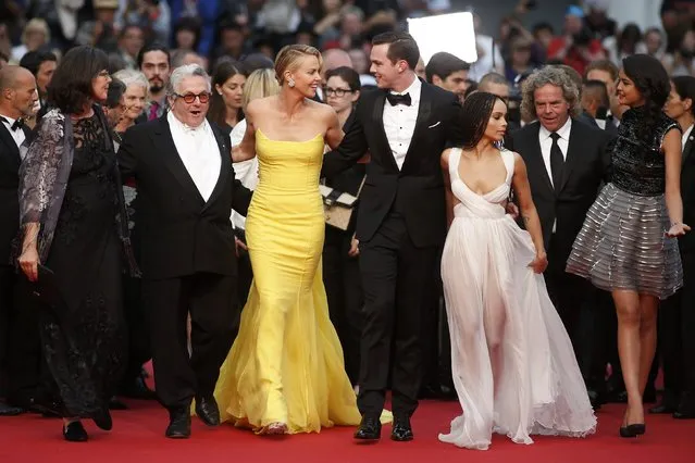 (L-R)  editor Margaret Sixel, director George Miller, cast members Charlize Theron, Nicholas Hoult, Zoe Kravitz, producer Doug Mitchell, and actress Courtney Eaton pose on the red carpet as they arrive for the screening of the film “Mad Max: Fury Road” out of competition at the 68th Cannes Film Festival in Cannes, southern France, May 14, 2015. (Photo by Benoit Tessier/Reuters)