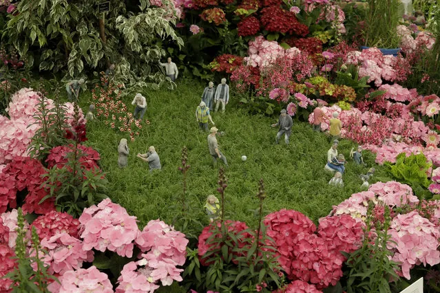 Figurines are displayed as part of the Floella's Future stand at the RHS (Royal Horticultural Society) Chelsea Flower Show in London, Monday, May 20, 2019. World-renowned and quintessentially British, the annual show is a celebration of horticultural excellence and innovation. (Photo by Matt Dunham/AP Photo)