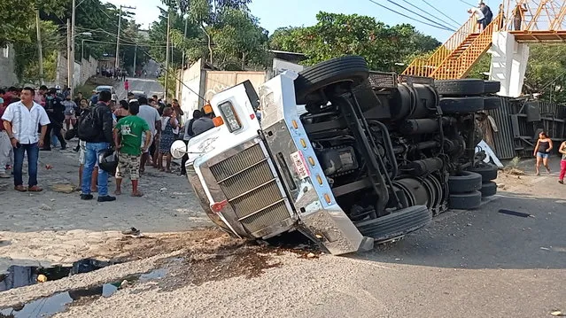 An overturned truck is seen after a trailer crash in the southern Mexican state of Chiapas killed at least 49 people, most of them migrants from Central America, officials said on Thursday, in Tuxtla Gutierrez, Chiapas, Mexico on December 9, 2021, in this picture obtained from social media. (Photo by El La Mira via Reuters)