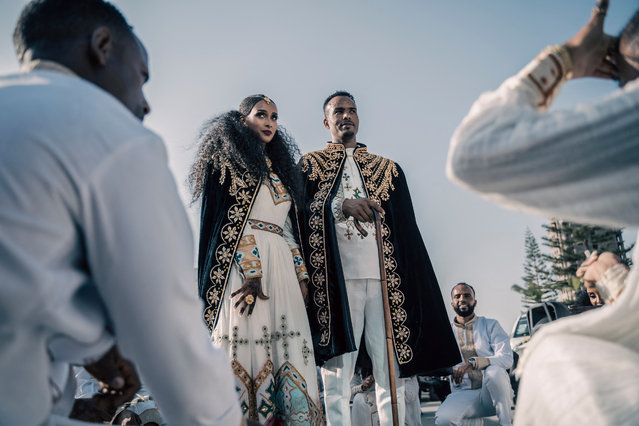Couples who are getting married dance in the street in the streets of Mekelle, Ethiopia, on May 26, 2024. (Photo by Amanuel Sileshi/AFP Photo)
