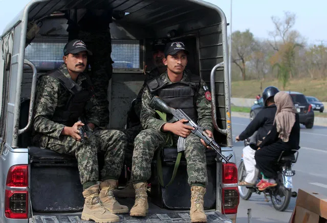 Pakistani Rangers personel keep guard while patroling on the streets in Islamabad, Pakistan, February 20, 2017. (Photo by Faisal Mahmood/Reuters)