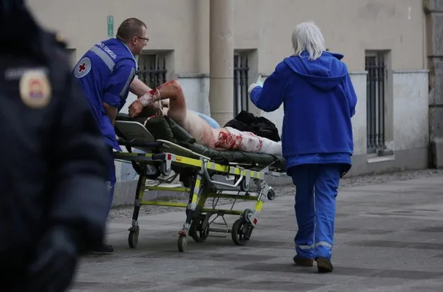 Ambulance workers push a stretcher carrying an injured person at the entrance to Tekhnologichesky Institut station of the St Petersburg metro in the aftermath of an explosion which occurred in a train at 14:40 Moscow time on April 3, 2017. According to Russian National Antiterrorism Committee several people were killed in the explosion. (Photo by Anton Vaganov/TASS)