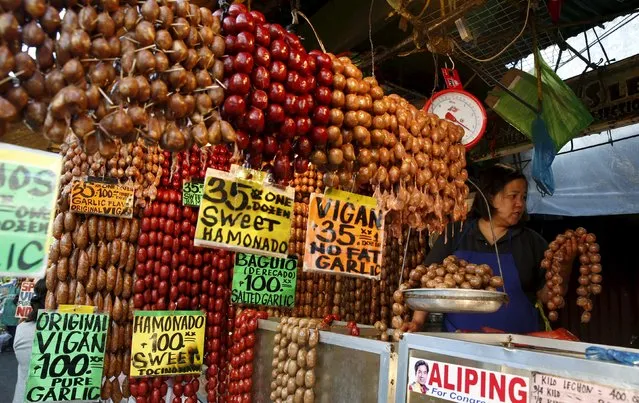 A woman sells local sausages at a food stall in the mountain resort of Baguio city in northern Philippines April 17, 2016. (Photo by Erik De Castro/Reuters)