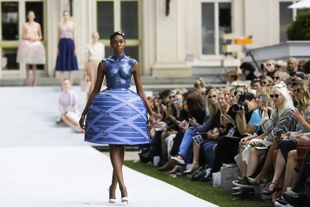 A model wears a creation of fashion designer Marina Hoermanseder's Spring/Summer 2016 collection during the Mercedes-Benz Fashion Week in Berlin, Friday, July 10, 2015. (Photo by Markus Schreiber/AP Photo)