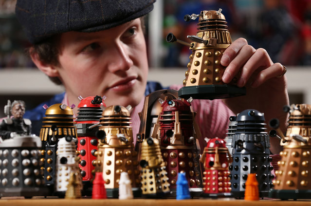 Alex Morgan of Vintage Toy Exchange in Matlock, Derbyshire, and Dr Who expert, takes a closer look at a Dalek on March 29, 2023. Daleks first appeared on television in 1963, and came from the factitious planet, Skaro. This year is the 60th anniversary of the iconic programme, with William Hartnell being the first Doctor Who. (Photo by Lorne Campbell/Guzelian)