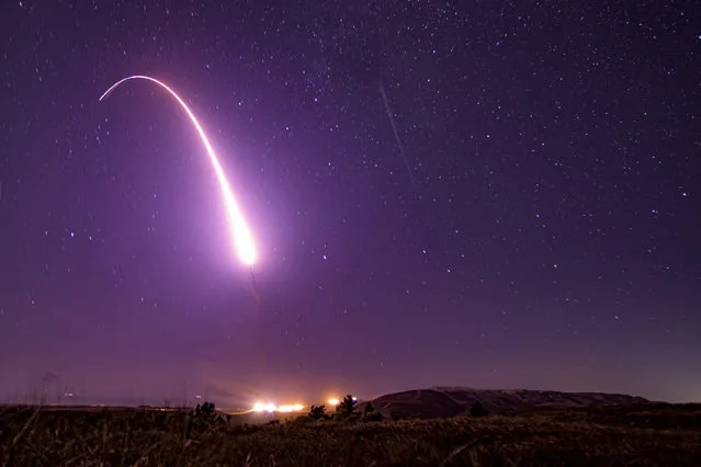 This US Air Force handout photo shows an unarmed Minuteman III intercontinental ballistic missile launching during an operational test at 1:13 a.m. Pacific Time, October 2, 2019, at Vandenberg Air Force Base, California. The US military said Wednesday it had tested an unarmed Minuteman III intercontinental ballistic missile equipped with reentry vehicle from a base in California across the Pacific Ocean. Launched from Vandenberg Air Force Base at 1:13 am local time (0813 GMT) the reentry vehicle traveled approximately 4,200 miles (6,750km) across the Pacific Ocean to the Kwajalein Atoll in the Marshall Islands, the Air Force Global Strike Command said in a statement. (Photo by J.T. Armstrong/US Air Force/AFP Photo)