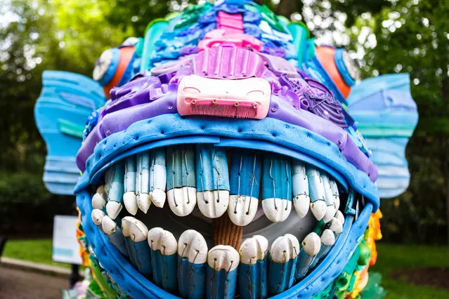 A parrotfish, made from debris from the world’s oceans, is part of a larger art project representing the some 315 billion pounds of trash currently found at sea. The fish, along with other ocean species, can be found at the National Zoo. (Photo by Keith Lane/The Washington Post)