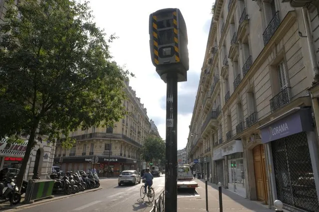 A speed camera is pictured in a street, Monday, August 30, 2021 in Paris as the speed limit on nearly all streets of Paris is just 30 kph (less than 19 mph). t's the latest initiative by a city trying to burnish its climate credentials and transform people's relationship to their vehicles. City officials say it's also aimed at reducing accidents and making Paris more pedestrian-friendly. (Photo by Francois Mori/AP Photo)