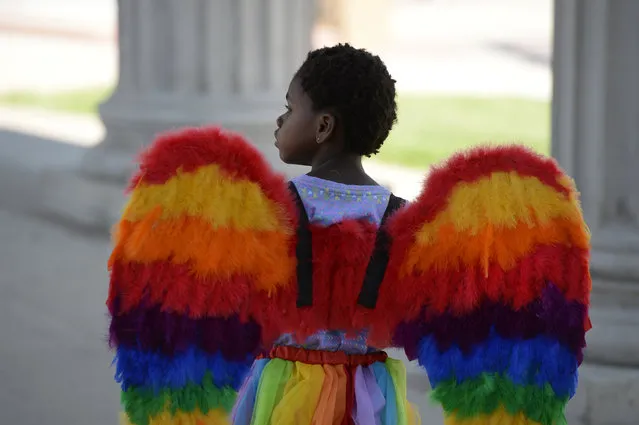 Ellie Ozbayrak, 4, sports rainbow wings at the annual PrideFest celebration at Civic Center Park June 18, 2016. (Photo by Andy Cross/The Denver Post)