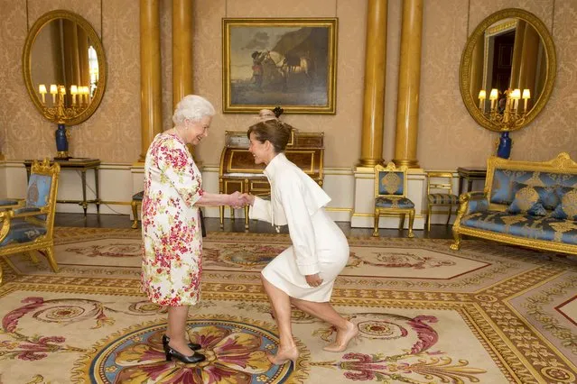 President of the Royal Academy of Dance Darcey Bussell meets Britain's Queen Elizabeth during the presentation of the Queen Elizabeth II Coronation Award to choreographer Sir Matthew Bourne at Buckingham Palace, in central London, Britain June 24, 2016. (Photo by Dominic Lipinski/Reuters)