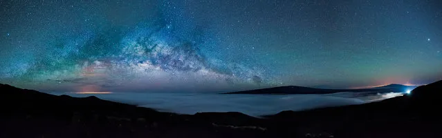 Earth’s Rise through the Universe, Hilo, US. Taken from the highest mountain of Hawaii, Mauna Kea, and overlooking the lava fields, the Milky Way mirrors the alignment of the horizon soaring over the volcanoes Mauna Loa (left) and Hualalāi (right). (Photo by Gianni Krattli/National Maritime Museum)