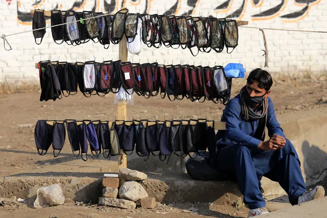 A man sells protective face masks after positive cases of novel coronavirus and Covid-19 disease were reported in the country and neighboring Afghanis?tan and Iran, in Peshawar, Pakistan, 27 February 2020. Dr. Zafar Mirza said one of the two infected persons recently travelled to Iran and is currently under treatment at a hospital in Karachi. Iran has been plunged into isolation as authorities grapple with an outbreak of coronavirus that has killed 50 people in the city of Qom alone. Neighboring countries Pakistan, Afghanistan, Turkey, Iraq and Armenia have closed their borders in a bid to contain the virus. (Photo by Arshad Arbab/EPA/EFE)