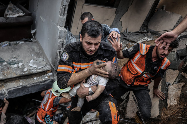 6 month-old Palestinian baby Sama Alwadia is being rescued under rubble after Israeli airstrike in Gaza Strip on October 09, 2023. (Photo by Ali Jadallah/Anadolu Agency via Getty Images)