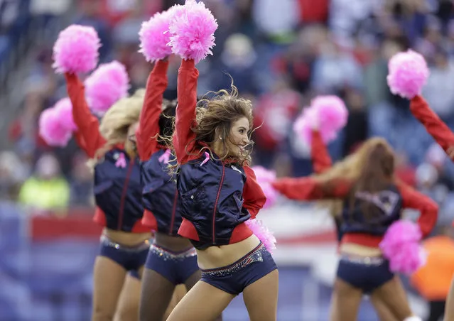 New England Patriots cheerleaders perform in the fourth quarter of an NFL football game against the Miami Dolphins Sunday, October 27, 2013, in Foxborough, Mass.  (Photo by Steven Senne/AP Photo)