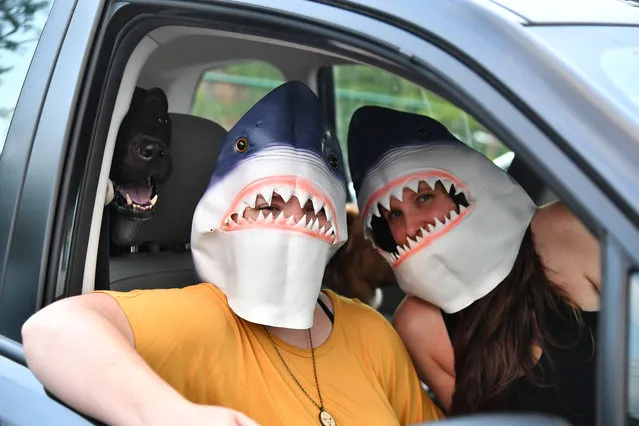 Guests attend a screening of the movie “Jaws” at a pop up drive-in movie theater at Plaza Theatre on May 23, 2020 in Atlanta, Georgia. Governor Brian Kemp announced that certain businesses, including movie theaters and restaurant dining rooms, could reopen on April 27, 2020; however, the drive-in movie theater concept remains popular because it allows for social distancing during the COVID-19 pandemic. (Photo by Paras Griffin/Getty Images)