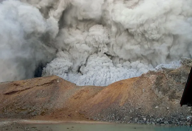 In this photo taken by an anonymous climber and was offered to Kyodo News, dense plumes rise near the summit crater of Mt. Ontake as the volcanic mountain erupts in central Japan, Saturday, September 27, 2014. (Photo by AP Photo/Kyodo News)