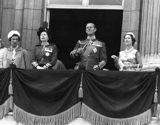 (L to R): The Duchess of Kent (1906–1968), Queen Elizabeth II, Prince Philip and Princess Margaret (1930–2002) watching an RAF fly past from Buckingham Palace balcony after the ceremony of Trooping the Colour. 13th June 1959. (Photo by Douglas Miller/Keystone)