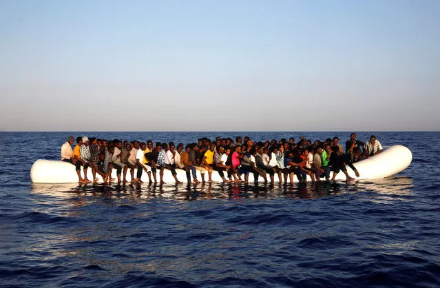 A dinghy overcrowded by African migrants is seen drifting off the Libyan coast in Mediterranean Sea August 20, 2016. (Photo by Giorgos Moutafis/Reuters)