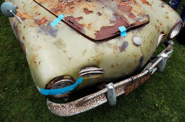 Duct tape holds a rusted Volkswagen Karmann Ghia together during the Concours d'LeMons in Seaside, California, U.S. August 20, 2016. (Photo by Michael Fiala/Reuters/Courtesy of The Revs Institute)