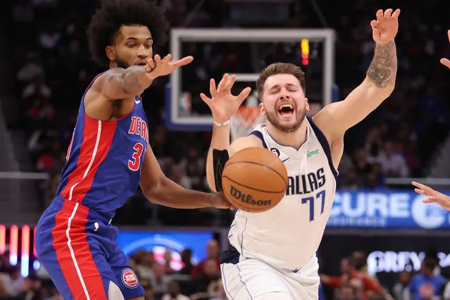 Luka Doncic #77 of the Dallas Mavericks battles for the ball against Marvin Bagley III #35 of the Detroit Pistons during the first period at Little Caesars Arena on December 01, 2022 in Detroit, Michigan. (Photo by Gregory Shamus/Getty Images)