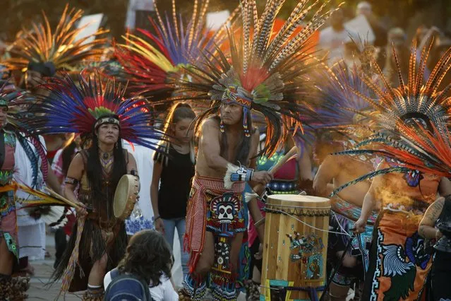 Native Americans head to a rally at the State Capitol in Denver, Colo., Thursday, September 8, 2016, to protest in solidarity with members of the Standing Rock Sioux tribe in North Dakota over the construction of the Dakota Access oil pipeline. The tribe argues that the pipeline, which crosses four states to move oil from North Dakota to Illinois, threatens water supplies and has already disrupted sacred sites. (Photo by David Zalubowski/AP Photo)