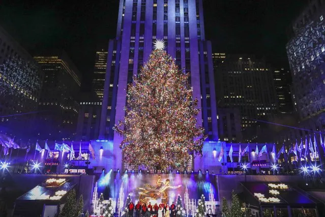 The Christmas Tree in Rockefeller Plaza is seen during the Lighting ceremony in New York City on November 30, 2022. (Photo by Kena Betancur/AFP Photo)