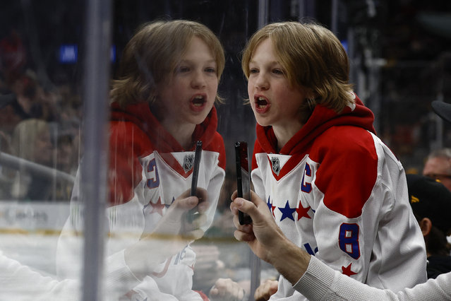 A young fan in the jersey of Washington Capitals left wing Alex Ovechkin (8) cheers during the third period of the game between the Boston Bruins and the Washington Capitals at TD Garden in Boston, Massachusetts on April 1, 2025. (Photo by Winslow Townson/Reuters)