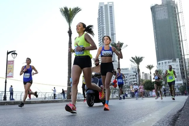 Runners compete in the 42-kilometer (26-mile) Beirut International Marathon in Beirut, Lebanon, Sunday, November 13, 2022. (Photo by Bilal Hussein/AP Photo)