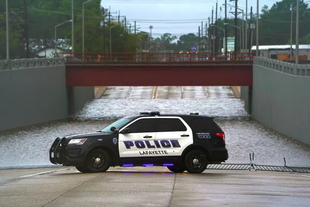 A police car is seen next to a flooded underpass after Hurricane Laura passed through Lafayette, Louisiana, U.S. on August 27, 2020. (Photo by Elijah Nouvelage/Reuters)