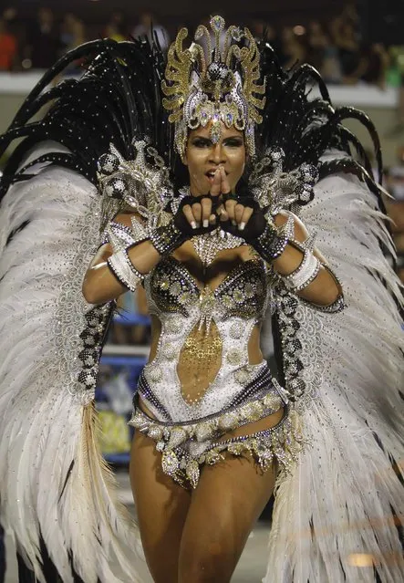 A reveller of Mocidade Independente samba school participates in the annual Carnival parade in Rio de Janeiro's Sambadrome, February 11, 2013. (Photo by Pilar Olivares/Reuters)