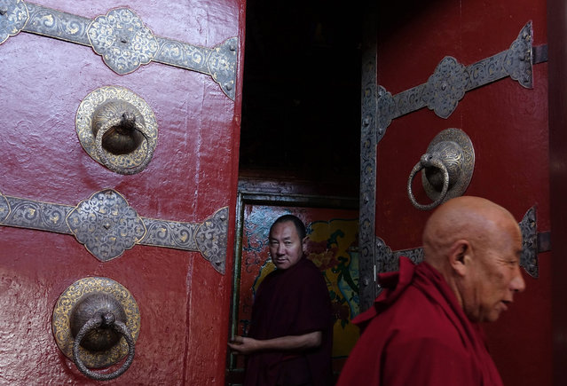 Tibetan monks enter the Jokhang Temple in Lhasa, Tibet Autonomous Region, China, 10 September 2016. Jokhang Temple is considered one of the most sacred site for Tibetan buddhists built during the rule of King Songtsen Gampo in the 7th century. (Photo by How Hwee Young/EPA)