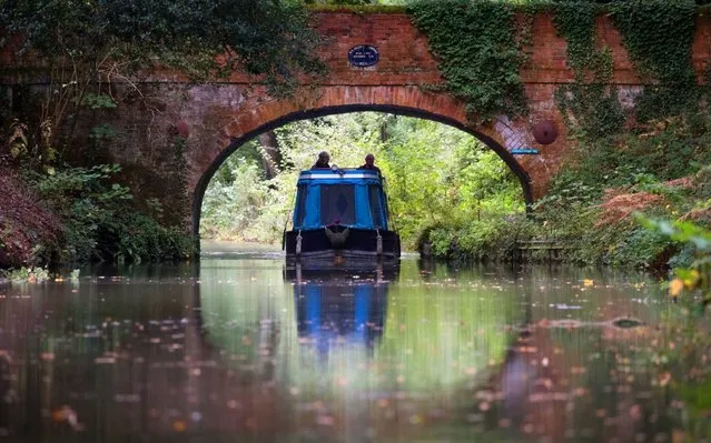 A narrowboat passes under Baseley's Bridge on the Basingstoke canal, near to Dogmersfield in Hampshire, England on October 8, 2019. (Photo by Andrew Matthews/PA Images via Getty Images)