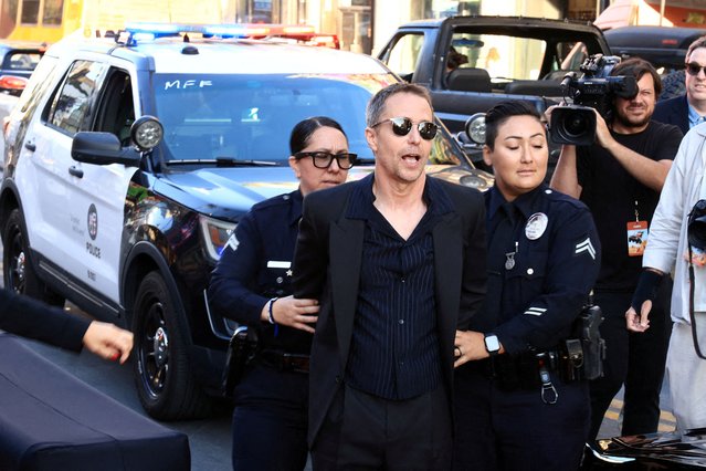 Sam Rockwell is escorted to the red carpet at the Los Angeles premiere of “The Bad Guys 2” in Los Angeles on July 24, 2025. (Photo by David Swanson/Reuters)