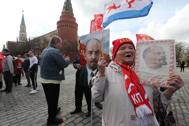 Russian Communist party supporters hold portraits of Vladimir Lenin as they walk to visit Lenin's mausoleum on the Red square in Moscow, Russia, 22 April 2024. Communists celebrate the 154th birth anniversary of Vladimir Ilyich Ulyanov, better known by his alias Lenin, who was a Russian revolutionary, politician, and political theorist. He served as the first and founding head of the government of Soviet Russia from 1917 to 1924 and of the Soviet Union from 1922 to 1924. (Photo by Maxim Shipenkov/EPA/EFE)