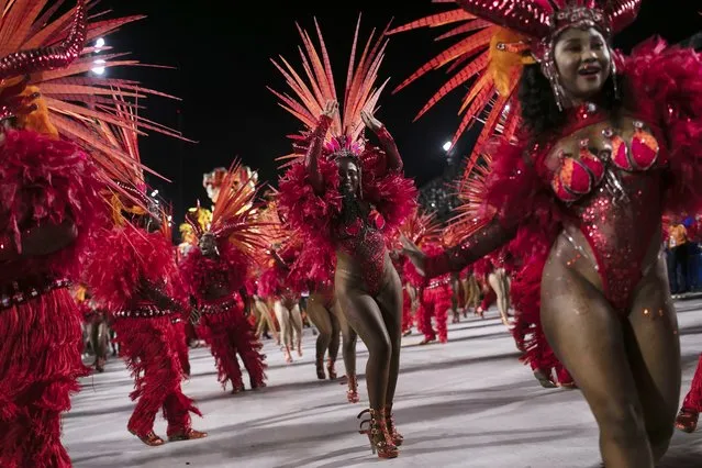 Performers from the Imperatriz Leopoldinense samba school parade on a float during Carnival celebrations at the Sambadrome in Rio de Janeiro, Brazil, Tuesday, February 21, 2023. (Photo by Bruna Prado/AP Photo)