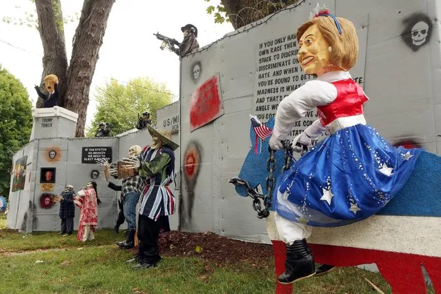 A Halloween display featuring a border wall and figures of Donald Trump, Hillary Clinton and Bernie Sanders is seen on the property of Matt Warshauer in West Hartford, Connecticut, U.S. October 4, 2016. (Photo by Michelle McLoughlin/Reuters)