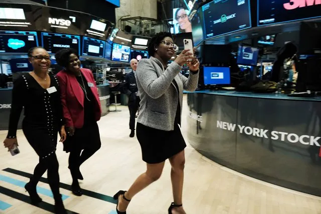 Women with the non-profit organization Black Women on Boards (BWOB) walk on the floor of the New York Stock Exchange (NYSE) on February 14, 2023 in New York City. The Dow was down in morning trading following news that the January consumer price index (CPI) report showed that inflation grew at a 6.4% annual rate, which was slightly higher than expected. (Photo by Spencer Platt/Getty Images)