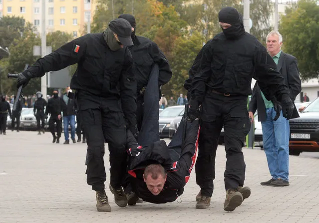 Belarusian policemen detain a participant during a rally to protest against the presidential election results in Minsk, Belarus, 27 September 2020. Opposition activists continue their every day protest actions, demanding new elections under international observation. (Photo by EPA/EFE/Stringer)