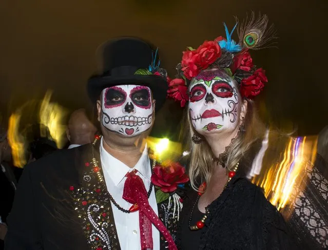 Participants gather before the start of a candlelight procession at the end of a three-day "Day of The Dead" (Dia de los Muertos) celebration in Old Town San Diego, California November 2, 2015. (Photo by Mike Blake/Reuters)