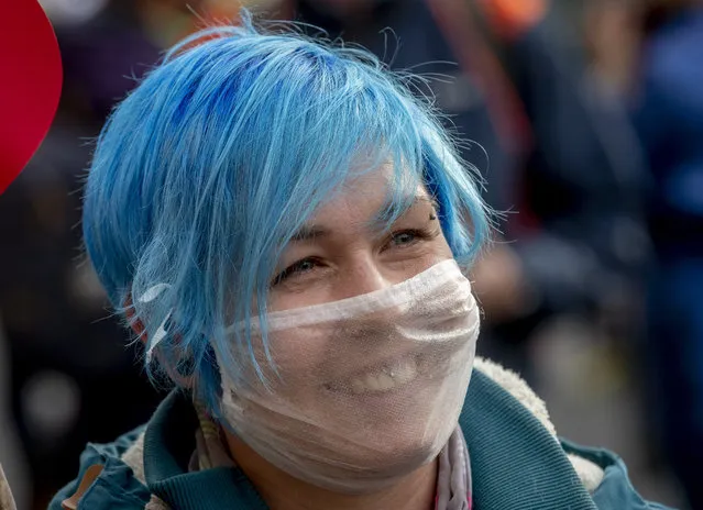 A woman takes part in a demonstration against the government's Corona restrictions in Frankfurt, Germany, Saturday, November 14, 2020. (Photo by Michael Probst/AP Photo)
