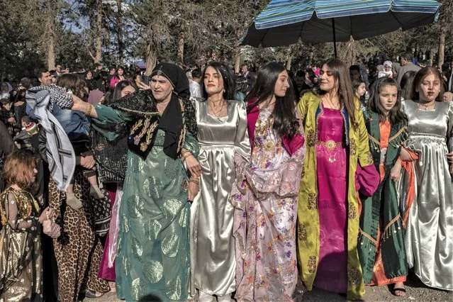 Iraqi Kurds celebrate Nowruz, a Persian New Year, in Sulaimaniyah, Iraq, Monday, March 20, 2023. (Photo by Hawre Khalid/Metrography via AP Photo)
