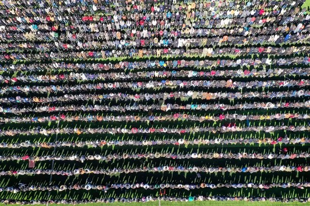 In this aerial view, Muslims perform the “rain prayer” (salat al esteka), inside a stadium in the Syrian rebel-held northwestern city of Idlib, on March 10, 2023. (Photo by Omar Haj Kadour/AFP Photo)