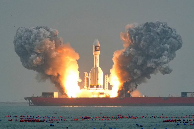 A Gravity-1 rocket lifts off from a launch ship in the waters off Haiyang in China's eastern Shandong province on October 11, 2025. The rocket, claimed to be the world biggest solid-fuel carrier rocket, was making its second launch and carried a wide-field satellite and two experimental satellites into orbit. (Photo by AFP Photo/China Stringer Network)